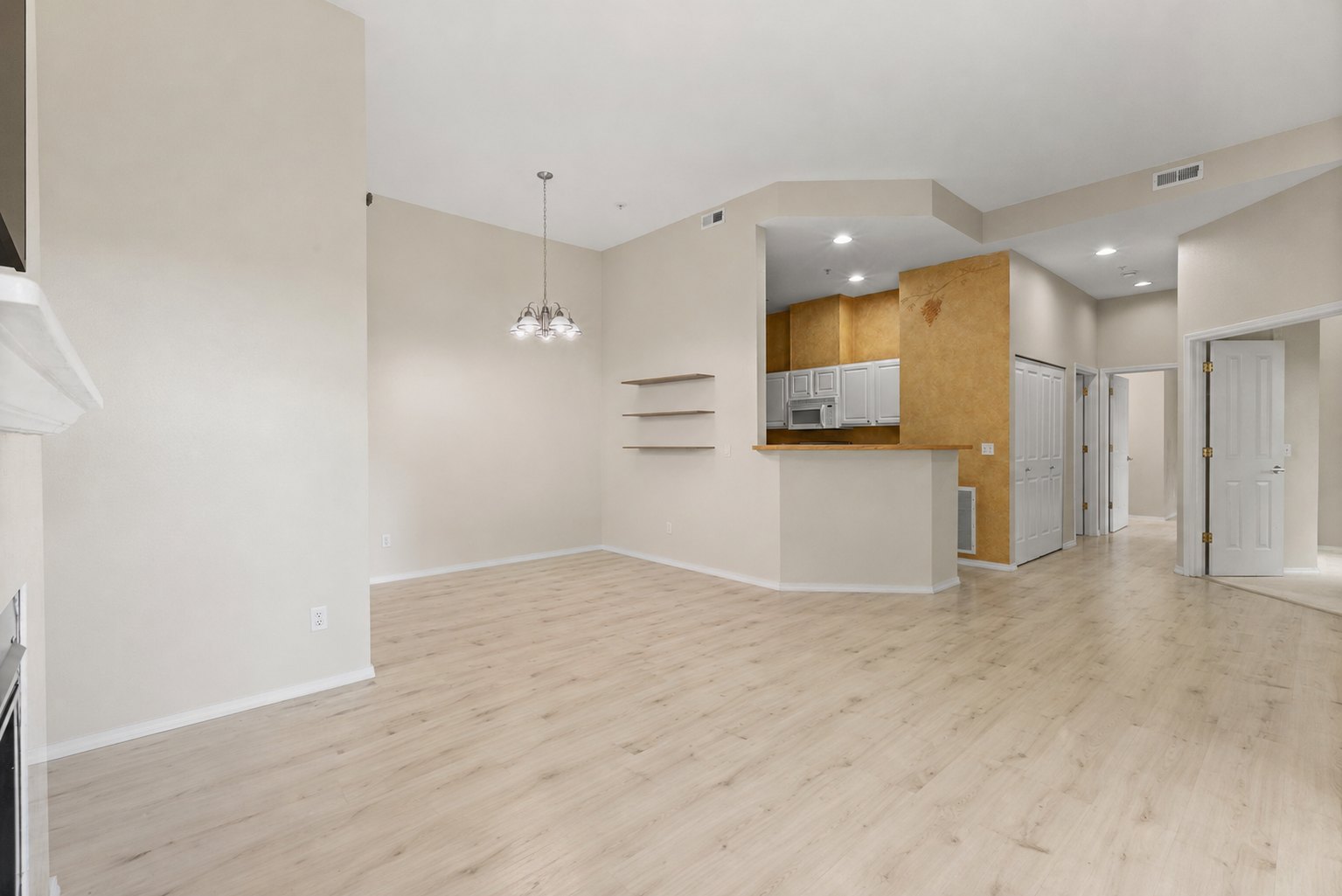 Furniture removal before and after for an open living and dining room after